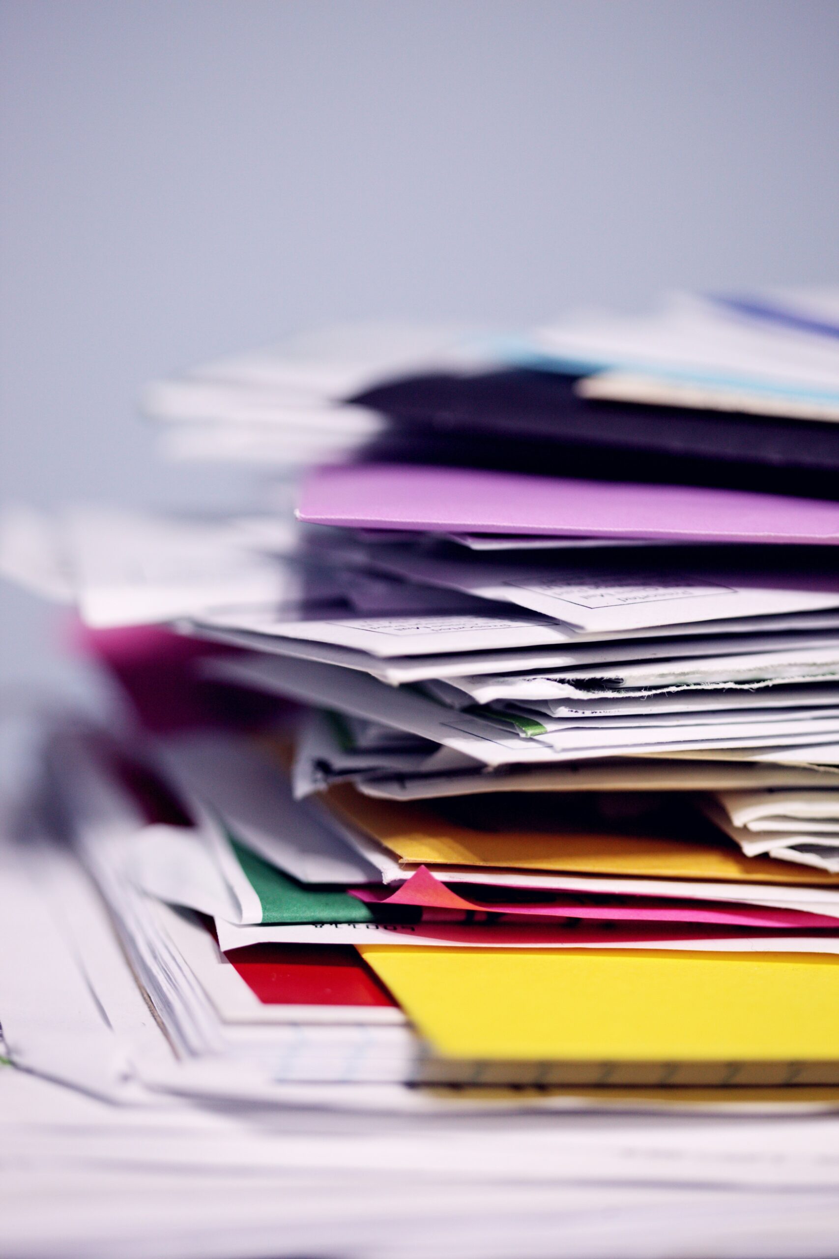 A colorful pile of papers and folders.